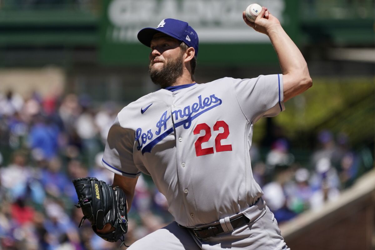 Los Angeles Dodgers starting pitcher Clayton Kershaw throws against the Chicago Cubs during the first inning in the first baseball game of a doubleheader, Saturday, May 7, 2022, in Chicago. (AP Photo/Nam Y. Huh)