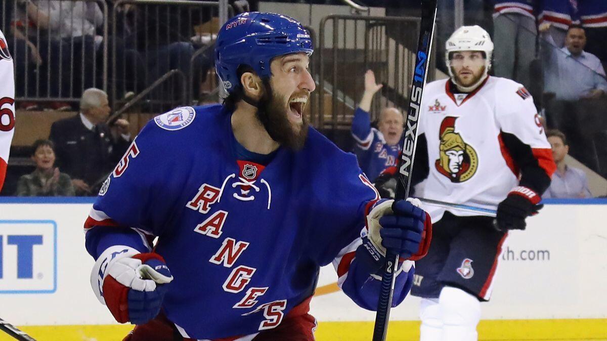 New York Rangers' Tanner Glass (15) celebrates a goal by Oscar Lindberg if the second period against the Ottawa Senators in Game 4 of the Eastern Conference second round of the Stanley Cup playoffs.