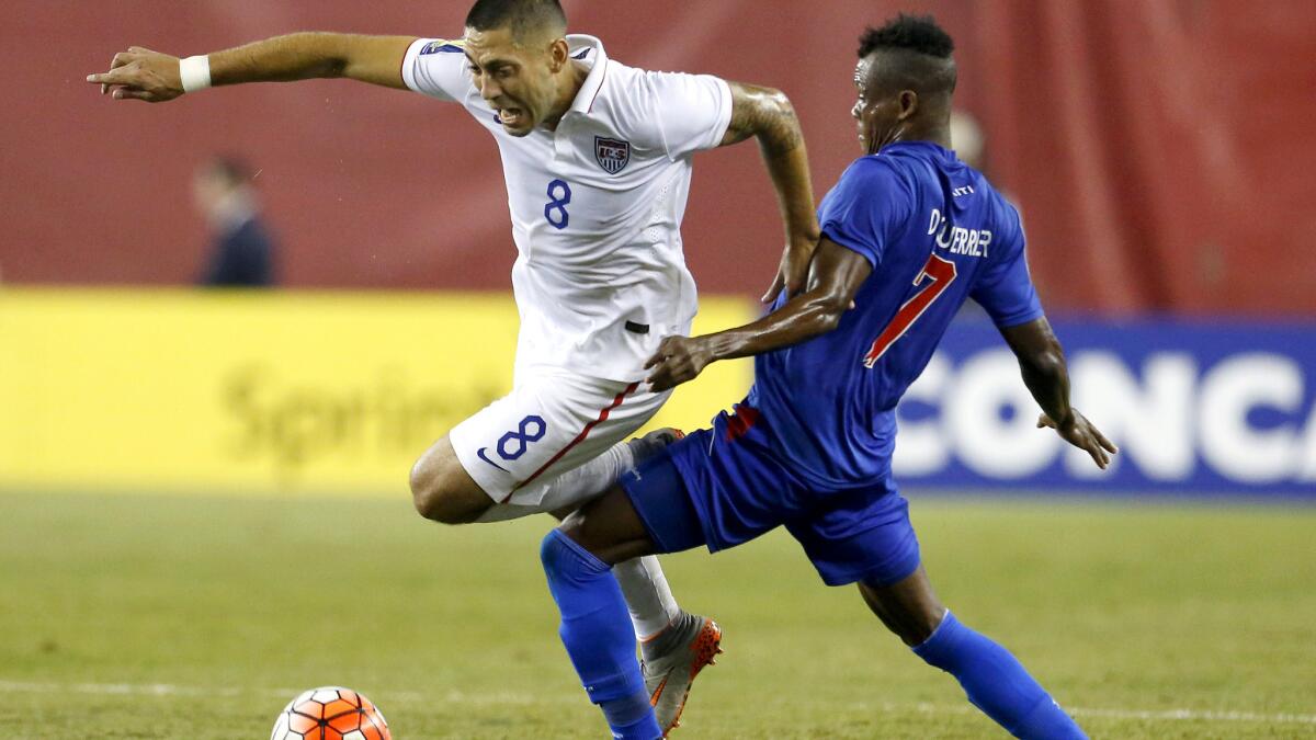 U.S. forward Cint Dempsey (8) is brought down by Haiti defender Wilde Donald Gurrier during their Gold Cup game Friday night in in Foxborough, Mass.