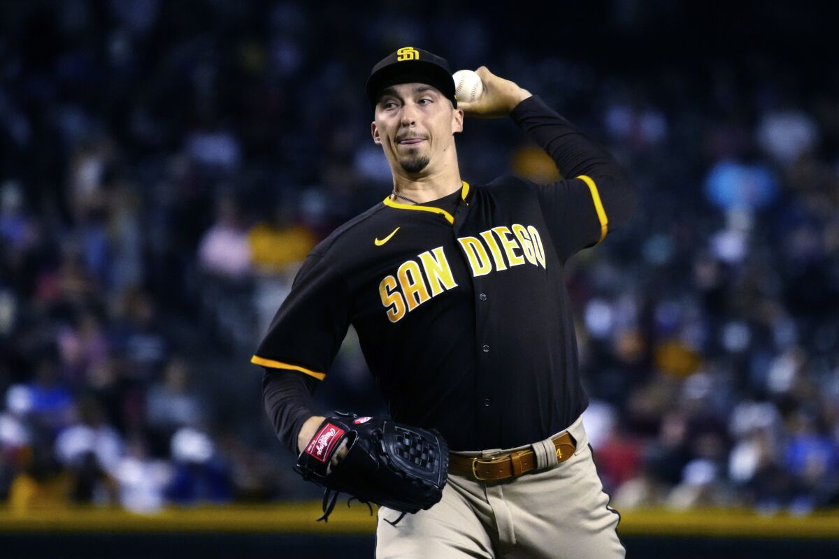 San Diego Padres pitcher Blake Snell throws to an Arizona Diamondbacks batter during the first inning of a baseball game Tuesday, Aug. 31, 2021, in Phoenix. (AP Photo/Rick Scuteri)