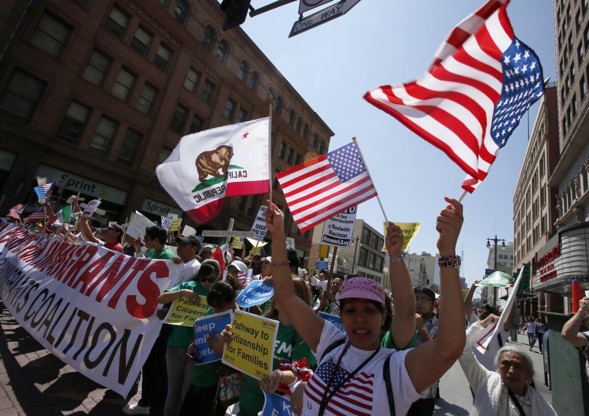 Several hundred people marched in downtown Los Angeles in support of comprehensive immigration reform.