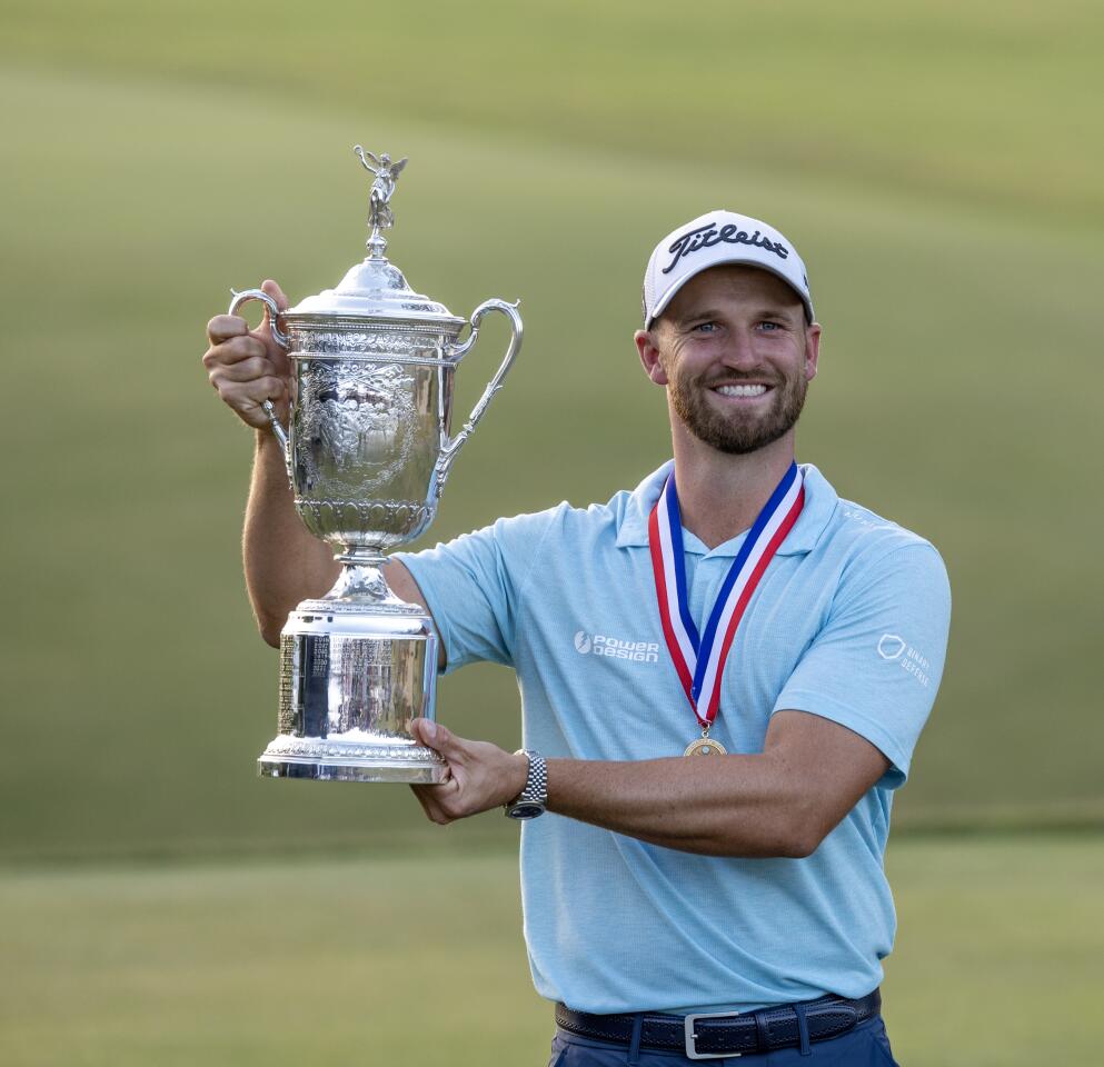 Wyndham Clark holds the U.S. Open championship trophy after winning at the Los Angeles Country Club on June 18.