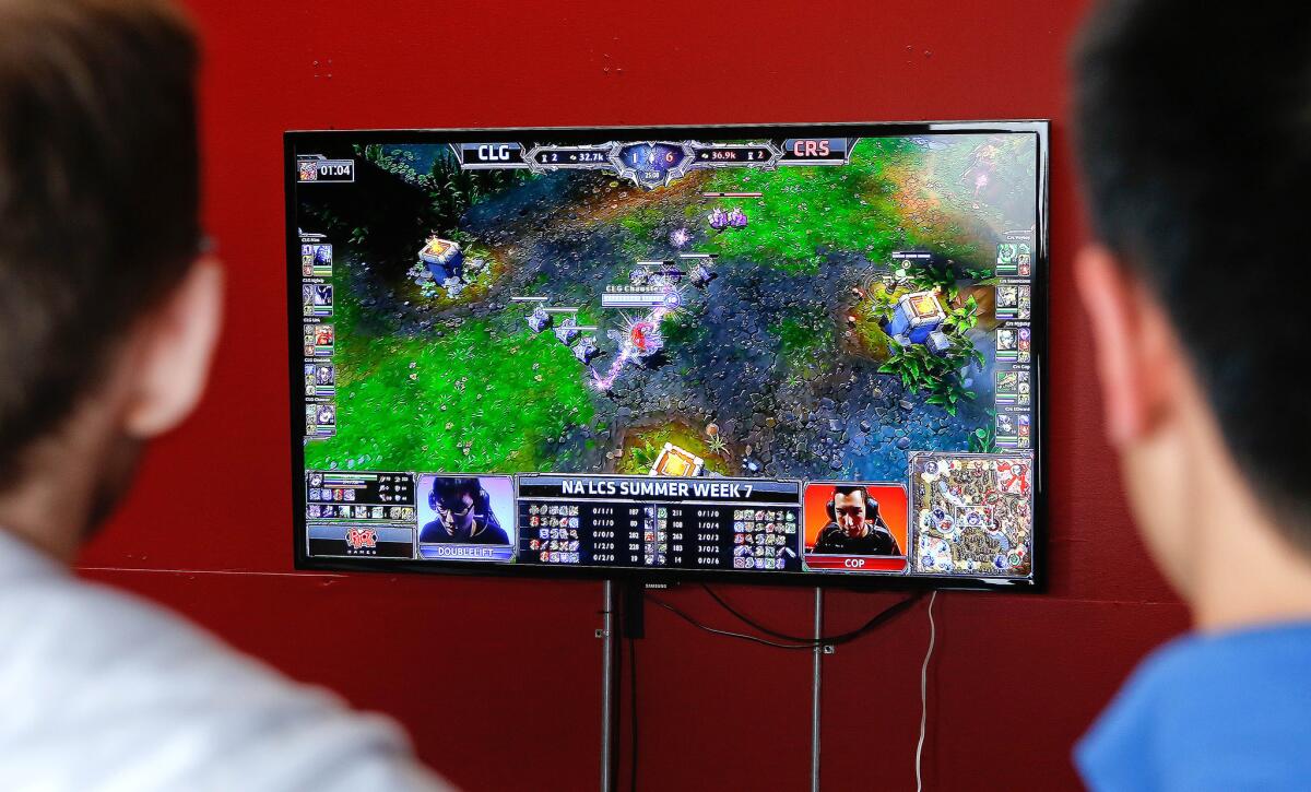 A monitor shows a live webcast of a match being played in the League Championship Series for League of Legends, a tournament for a PC-based video game, at Riot Studios in Santa Monica.