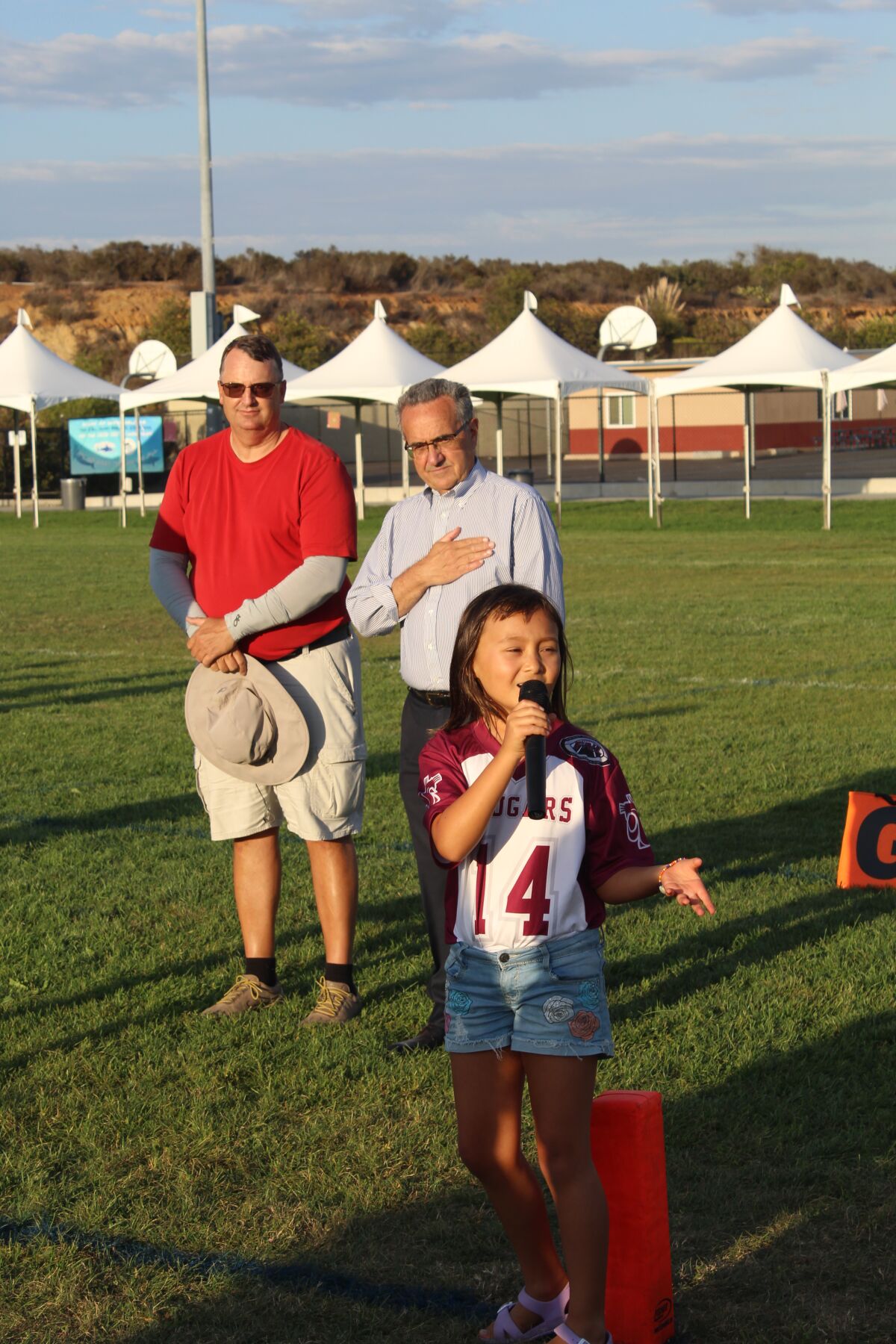Ava Mather sings "The National Anthem".