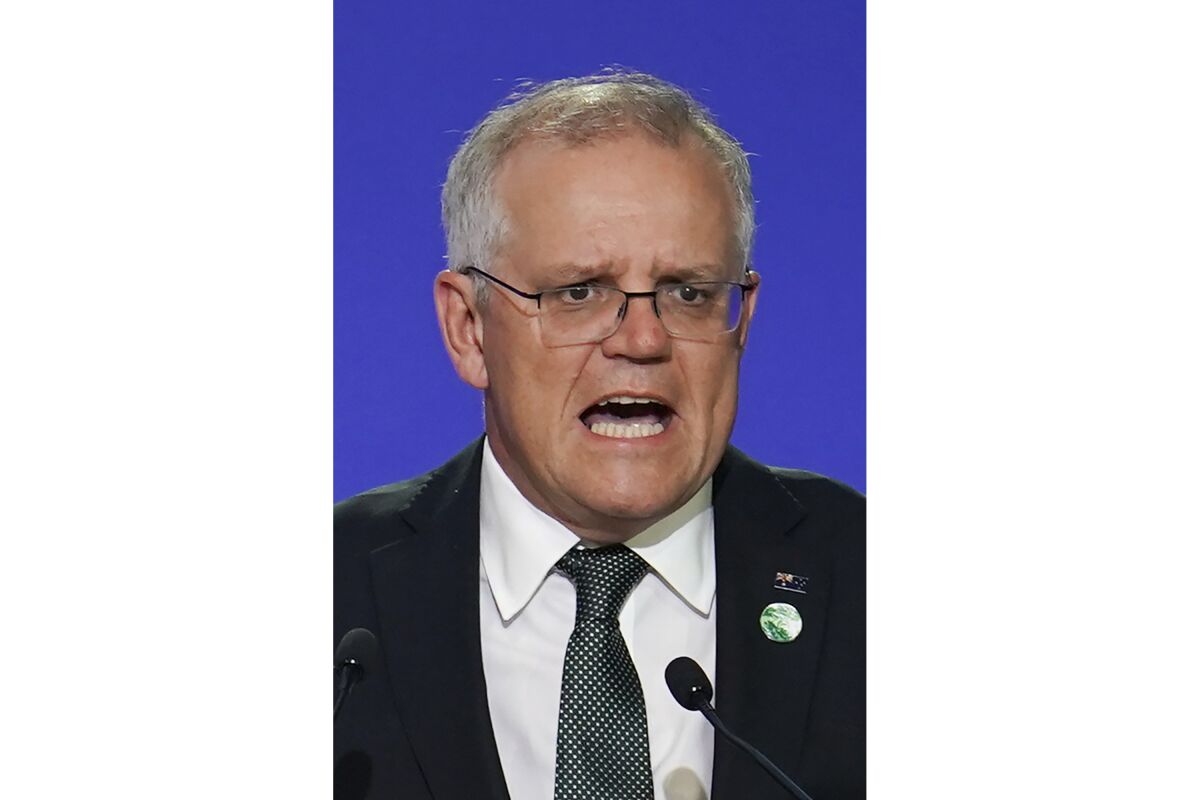 FILE - Australia's Prime Minister Scott Morrison delivers an address, during the COP26 Summit, at the SECC in Glasgow, Scotland, Monday, Nov. 1, 2021. In at least one sense, Morrison is the most successful Australian prime minister in years. He is the first to survive in office from one election to the next since 2007. That year, the government of Australia's second-longest-serving Prime Minister John Howard was voted out after a reign of almost 12 years. (Ian Forsyth/Pool Photo via AP, File)