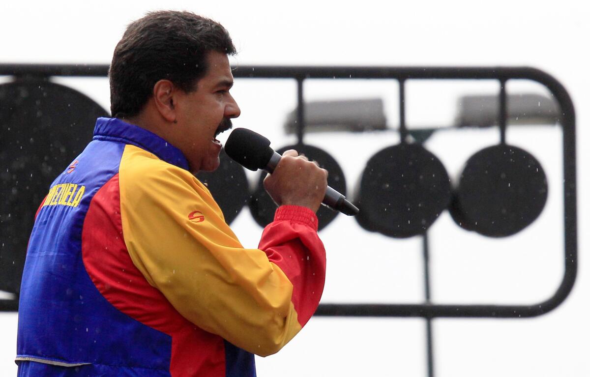 Venezuela's President Nicolas Maduro speaks during an event commemorating the one-year anniversary of the late Hugo Chavez's re-election outside Miraflores Palace in Caracas, Venezuela.