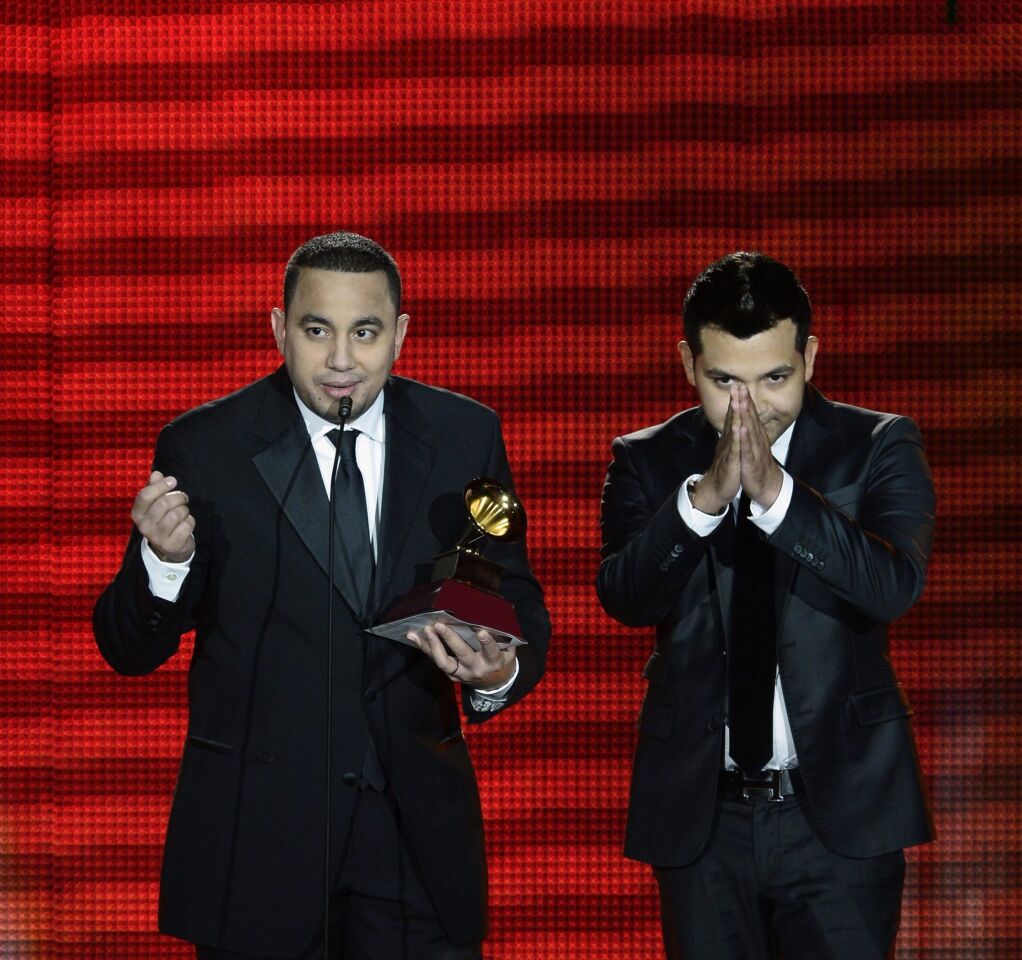 Musicians Felipe Pelaez and Manuel Julian accept their award for best cumbia/vallenato album for "Diferente."