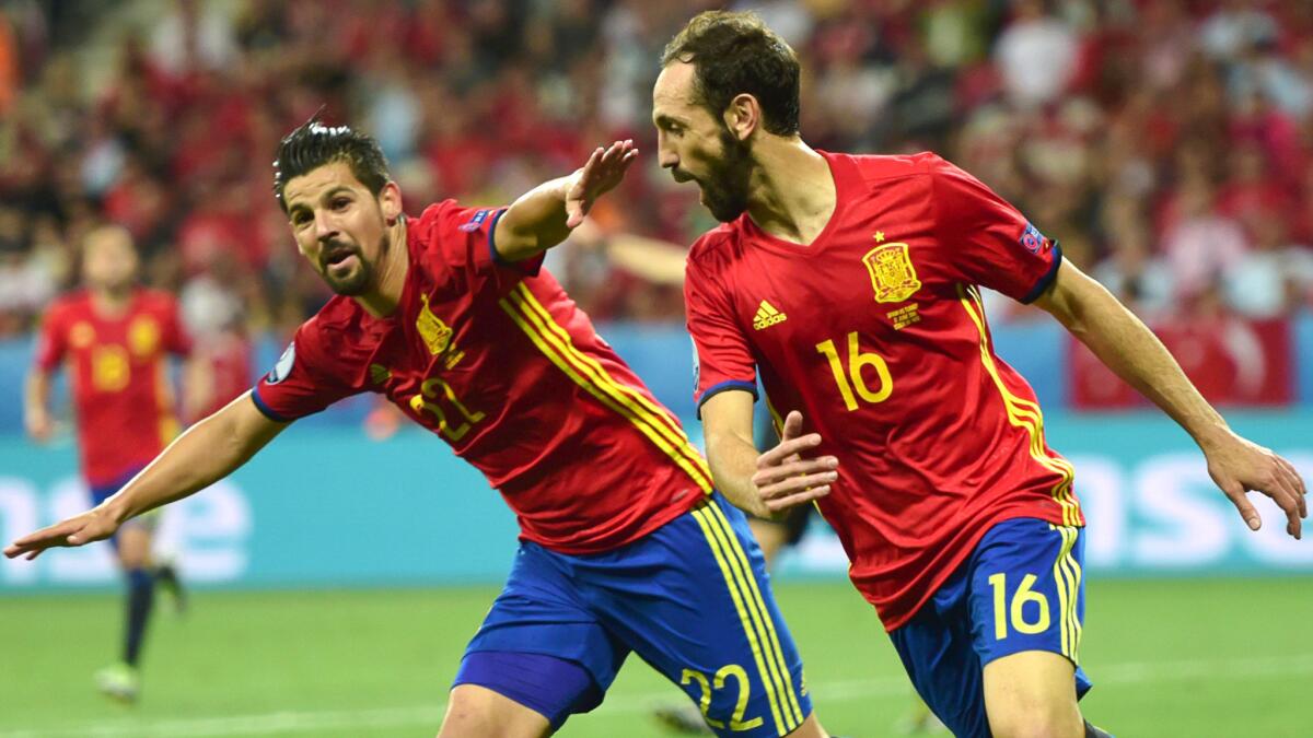 Spain forward Nolito (22) celebrates his goal against Turkey with teammate Juanfran (16) during a Euro 2016 Group D game Friday.