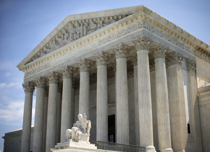 The U.S. Supreme Court building is shown. Justices said they will rule on whether religious schools, colleges and charities may refuse to cooperate in any way with the Obama administration's plan of offering free birth control to female employees.