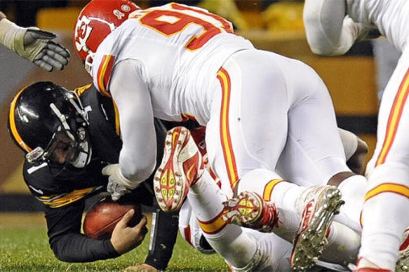 Pittsburgh quarterback Ben Roethlisberger is sacked by Kansas City linebacker Tamba Hali on Monday night. Roethlisberger left the game with a right shoulder injury.