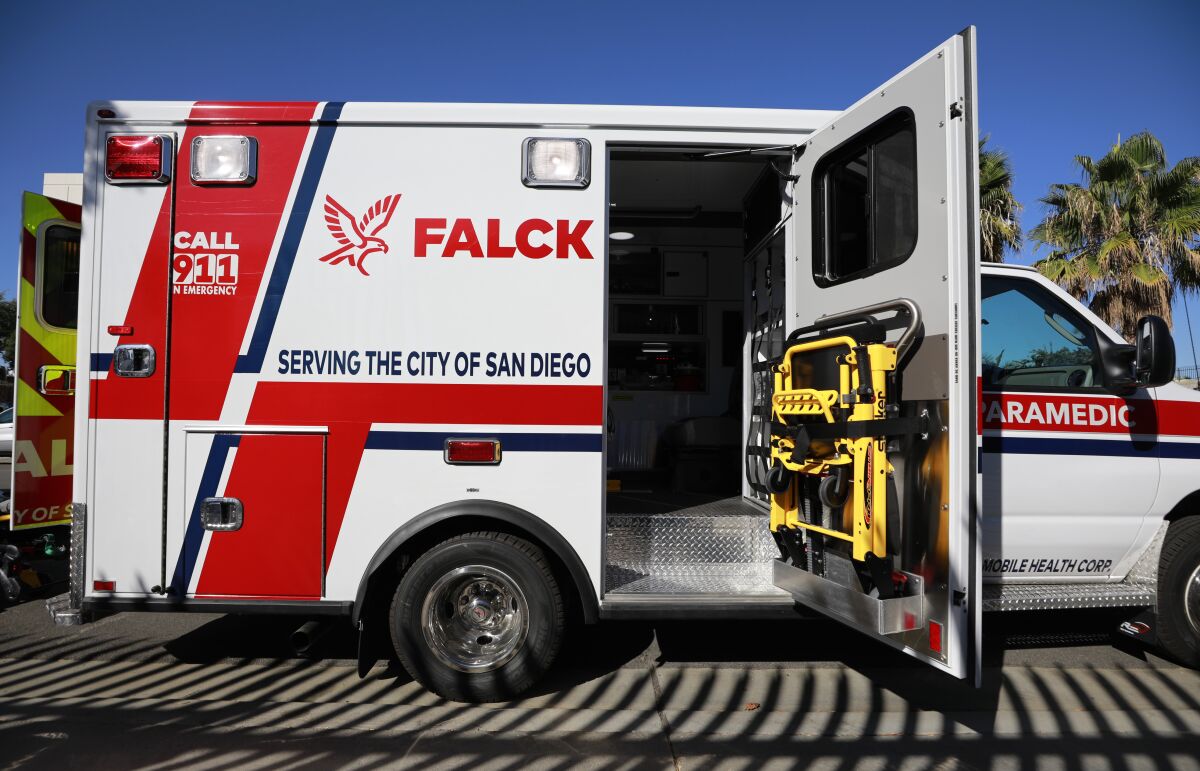 A Falck ambulance with its side door open