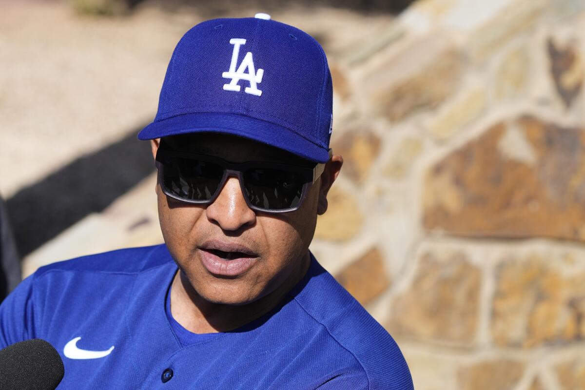 Dodgers manager Dave Roberts talks to the media at Camelback Ranch on Thursday.
