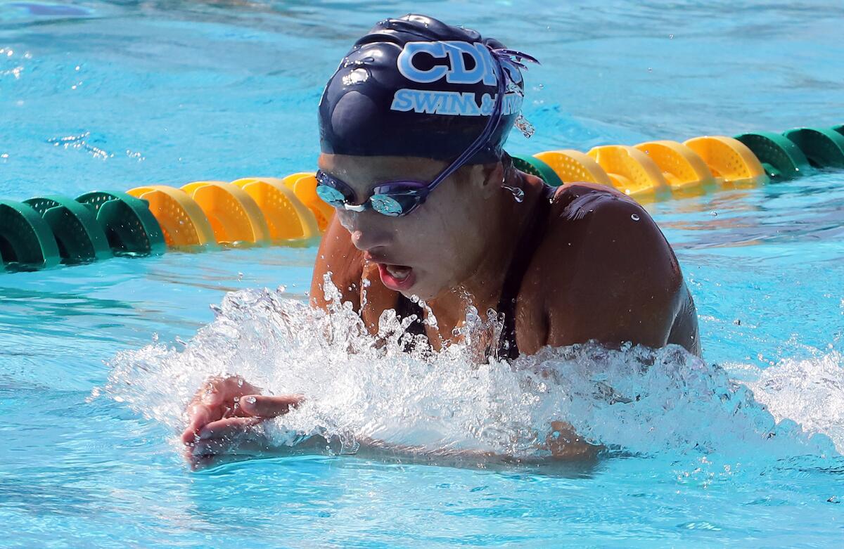CdM's Sofia Szymanowski swims the breaststroke during the Surf League swim finals at Golden West College on Friday.