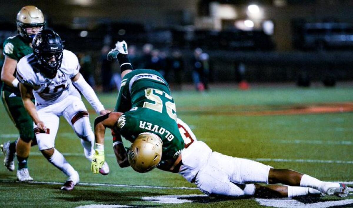 Koen Glover of St. Bonaventure goes airborne against Oaks Christian.