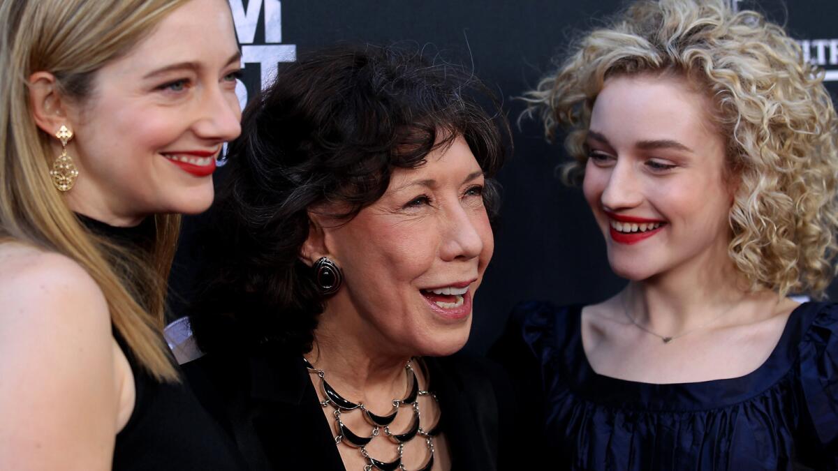 Actresses Judy Greer, left, Lily Tomlin and Julia Garner pose on the red carpet on opening night of the Los Angeles Film Festival. The festival paid tribute to Tomlin and premiered her latest film, "Grandma."