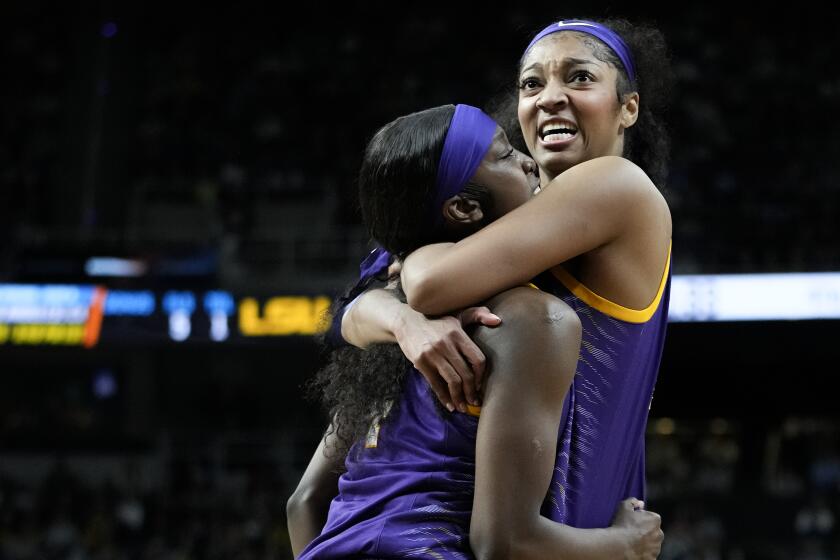 LSU guard Flau'jae Johnson (4) and LSU forward Angel Reese (10) react during the fourth quarter of a Sweet Sixteen round college basketball game against UCLA during the NCAA Tournament, Saturday, March 30, 2024, in Albany, N.Y. (AP Photo/Mary Altaffer)
