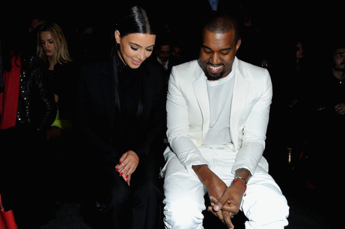 Kanye West and Kim Kardashian attend Givenchy's fall/winter 2013 ready-to-wear show.