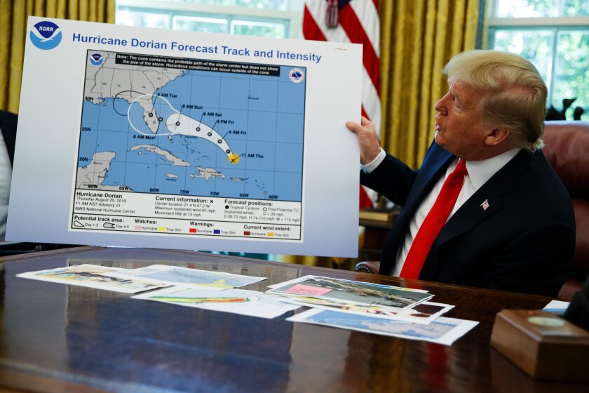 President Trump holds an apparently doctored hurricane map