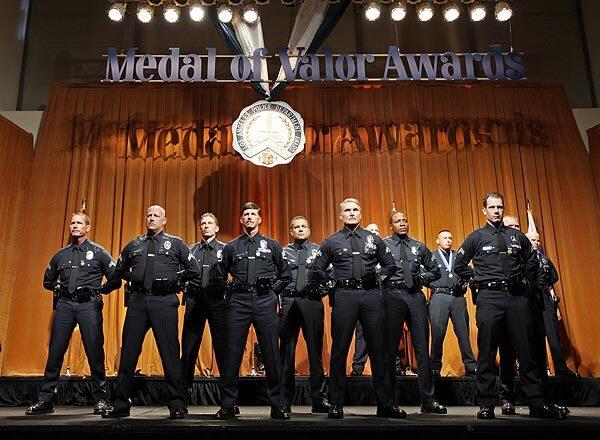 Recipients of the Los Angeles Police Department's Medal of Valor stand at attention during a ceremony Thursday. Seventeen officers got the medal, which is given for bravery and heroism. See full story