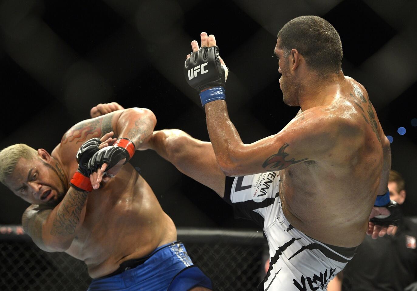 Antonio 'Bigfoot' Silva lands a kick against Mark Hunt during their heavyweight bout at UFC Fight Night on Saturday at the Brisbane Entertainment Center in Australia.