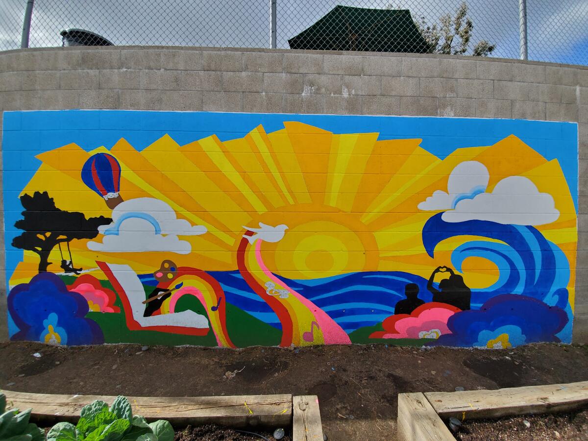 The new mural in R. Roger Rowe School's garden.