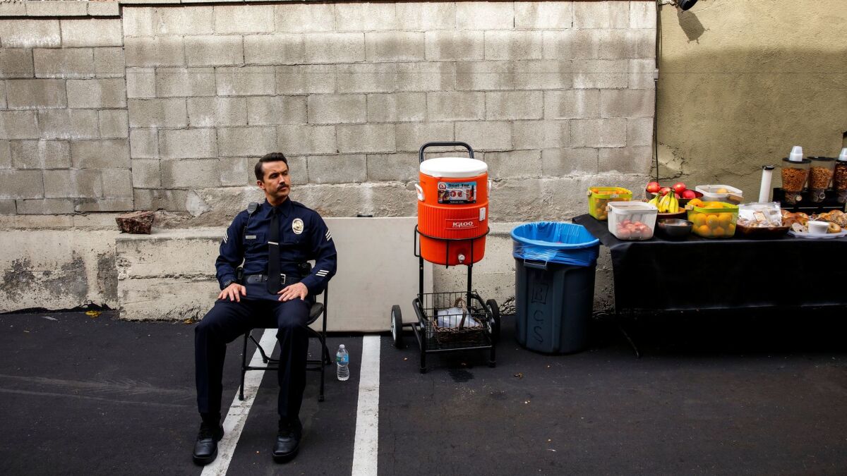 Actor Rob McElhenney, in costume, during a break from shooting a scene on FX's "Fargo" at a motel in Hollywood. (Jay L. Clendenin / Los Angeles Times)