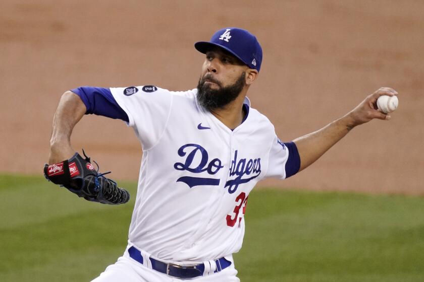 Los Angeles Dodgers starting pitcher David Price throws to the plate during the second inning of a baseball game.