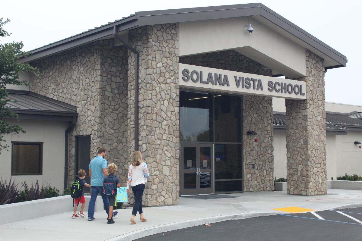 A family heads into Solana Vista School on the first day of school.