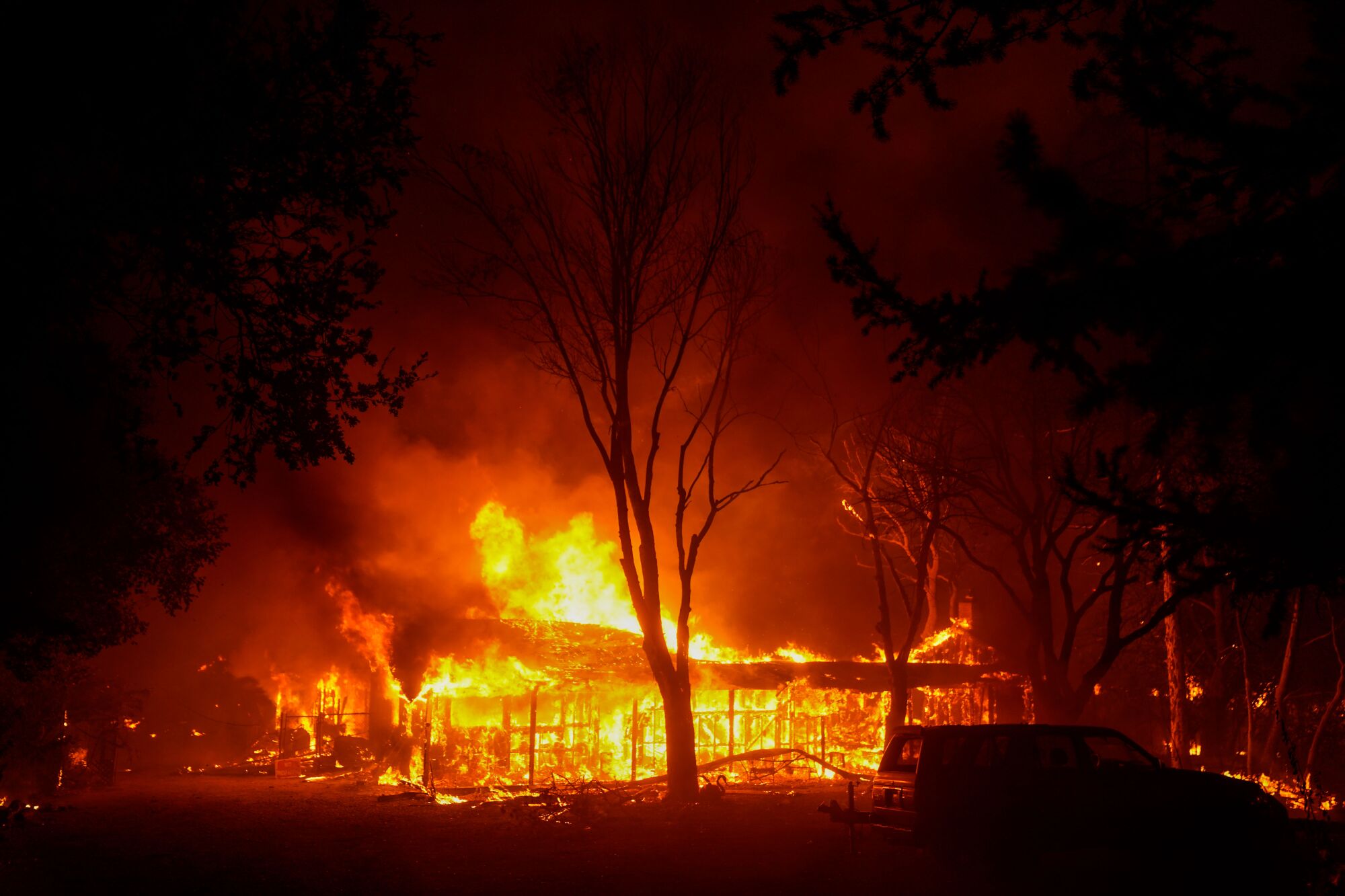 The Shady fire burns structures early Monday in Santa Rosa, Calif.