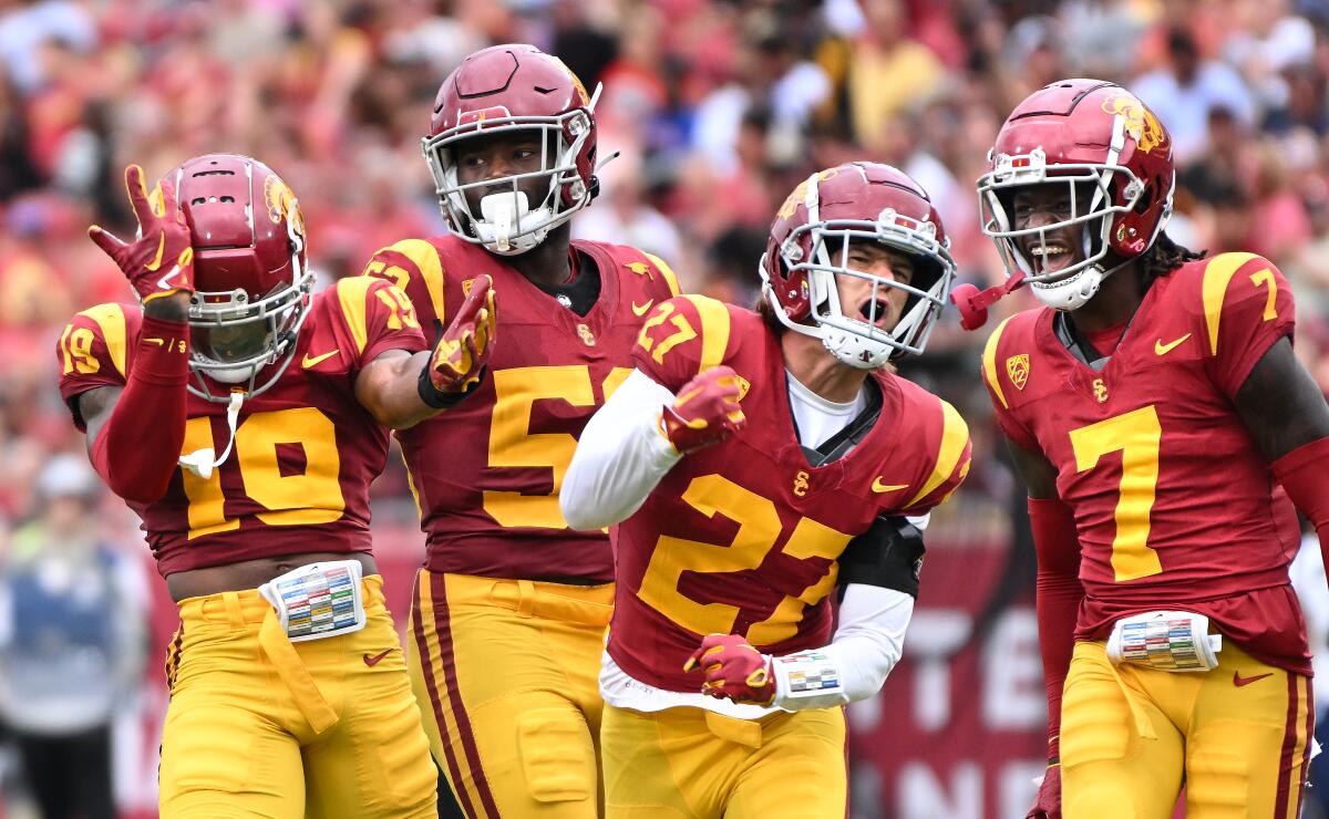 USC players (from left) Jaylin Smith, Shane Lee, Bryson Shaw and Caleb Bullock celebrate a defensive stop.