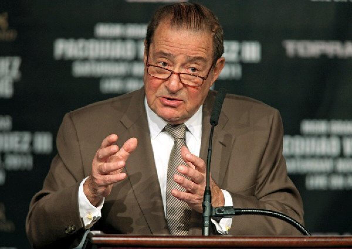 Bob Arum, shown at a news conference in November, said Friday, " I never had a discussion with Roger Mayweather about anything to do with Floyd Mayweather," contradicting Roger Mayweather.