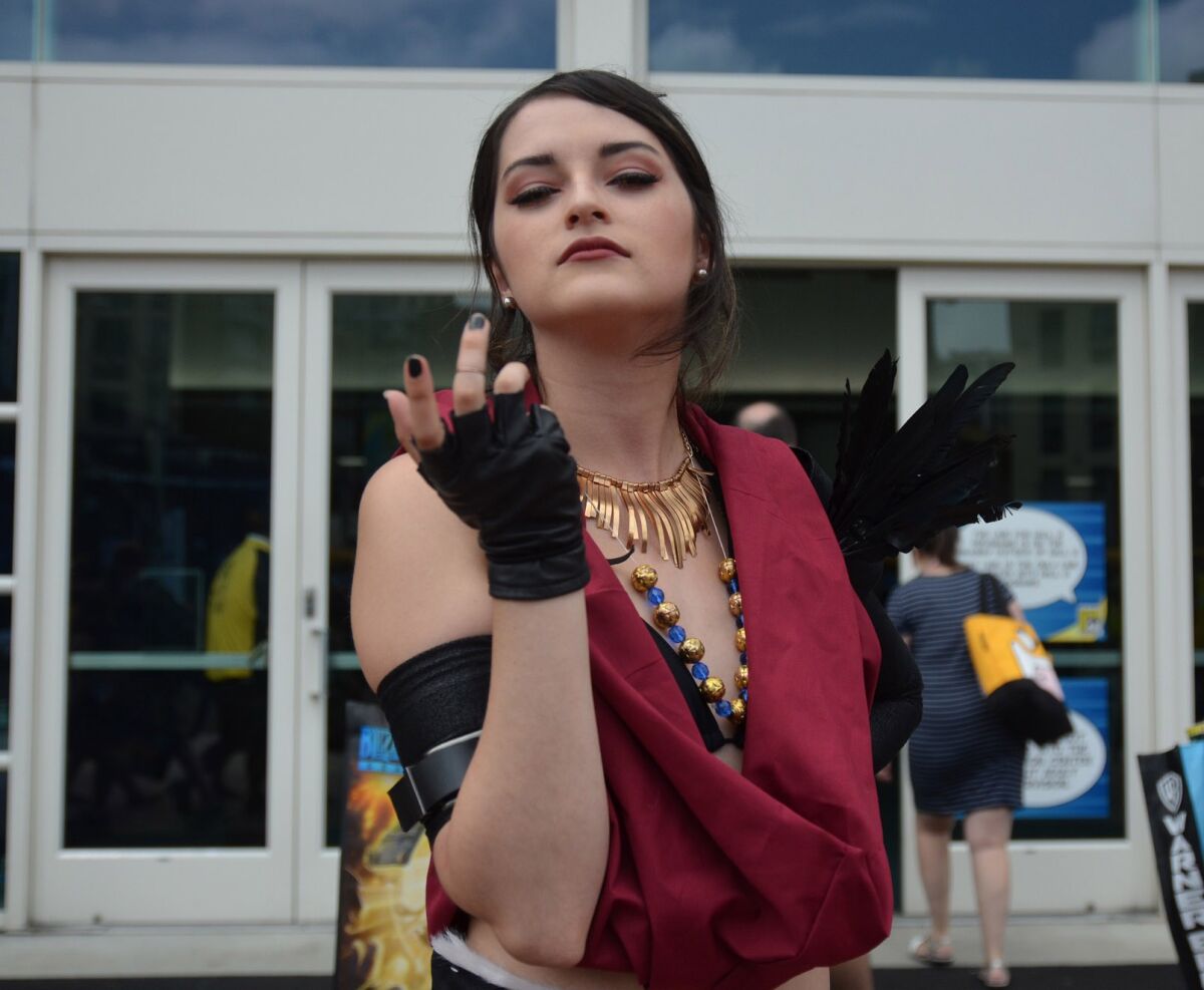 Maya Gutierrez, 22, of Temecula, dressed as Morrigan from "Dragon Age" at San Diego Comic-Con on Thursday, said she attends about five conventions each year and has been harassed before. "The worst time was when a guy put his arm around me for a photo and tried to stick his hand down the back of my pants," she said. "I love cosplaying, but this makes me re-think a lot of my costumes before I wear them in public."