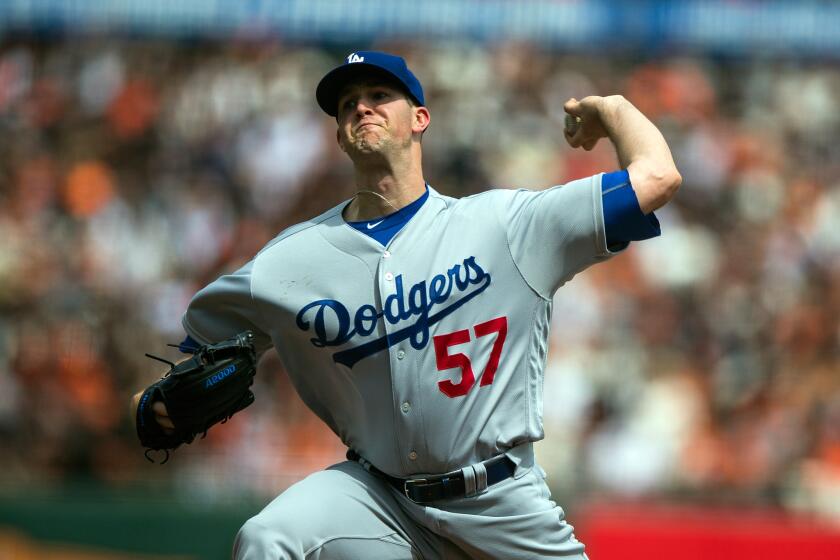 Dodgers pitcher Alex Wood (57) throws against the San Francisco Giants during the first inning on Apr. 7.