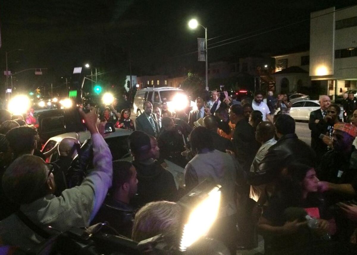 Black Lives Matter protesters swarm Los Angeles Mayor Eric Garcetti's car after disrupting a town hall meeting at a church in South L.A.