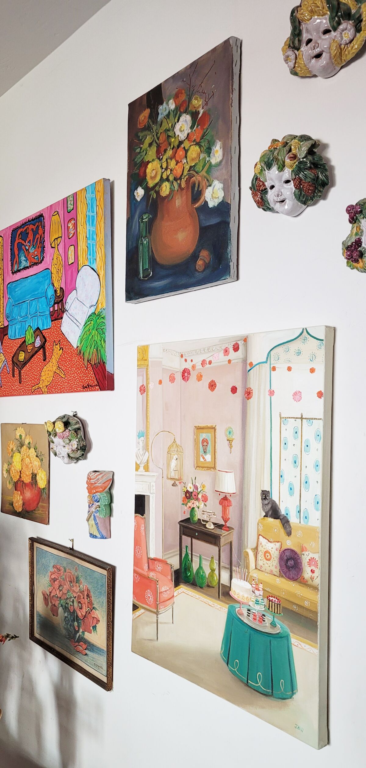 A gallery wall in Sheree Perelman’s Pacific Beach home features several of her beloved vintage florals.