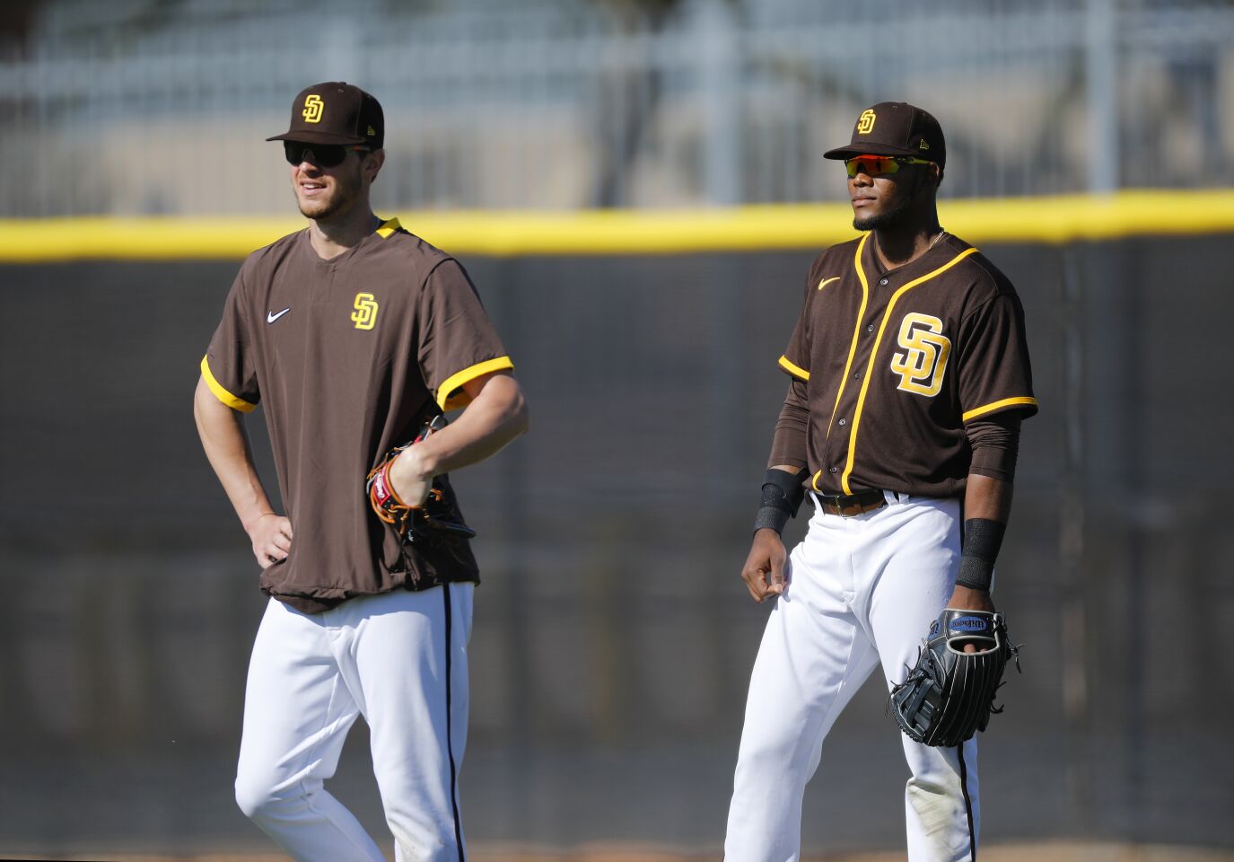 San Diego Padres Wil Myers, left, and Franchy Cordero wait for fly balls in right field during a spring training practice on Feb. 20, 2020.