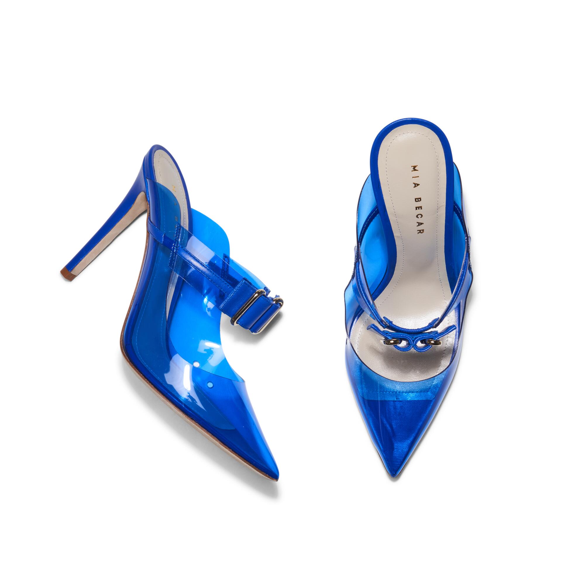 Blue high-heeled shoes by Mia Becar.