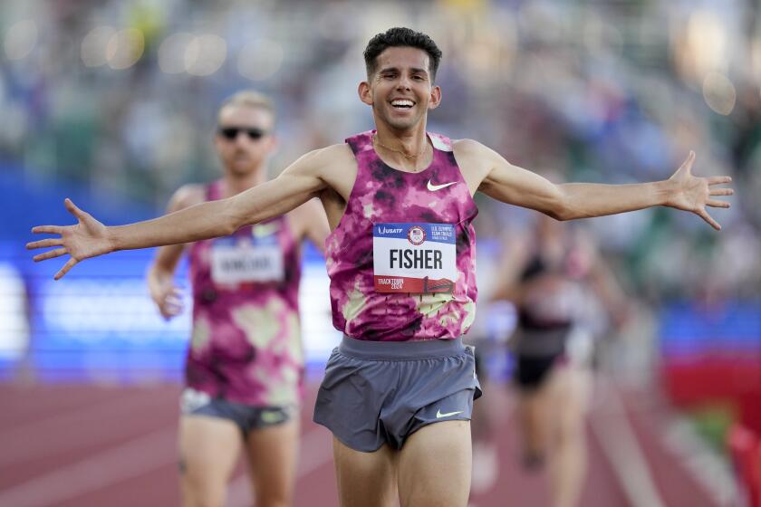 Grant Fisher wins the final in the men's 10000-meter run during the U.S. Track and Field Olympic Team Trials Friday, June 21, 2024, in Eugene, Ore. (AP Photo/Charlie Neibergall)
