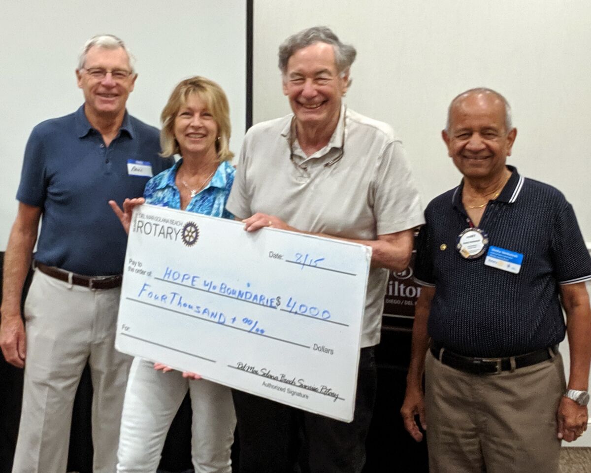 Del Mar-Solana Beach Rotary presented Hope Without Boundaries with $4,000 for improvements to the Campamento de Fe home for men in Tijuana who are injured or dying and have no family or resources. L to R: Paul Sagar, Hope Without Boundaries CFO, Lesley Sagar, Hope Without Boundaries president, Herb Liberman, DMSB Rotary International Service chair, and Venky Venkatesh, DMSB Rotary president.