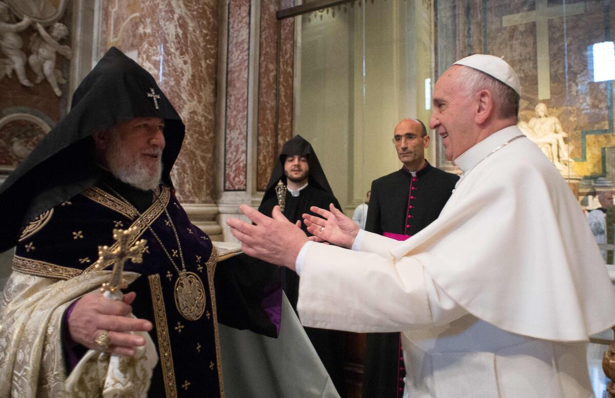 Pope Francis, right, is greeted by the head of Armenia's Orthodox Church Karekin II, left, during an Armenian-Rite Mass in St. Peter's Basilica, at the Vatican. Pope Francis on Sunday called the slaughter of Armenians by Ottoman Turks "the first genocide of the 20th century" and urged the international community to recognize it as such, sparking a diplomatic rift with Turkey. Turkey, which has long denied a genocide took place, immediately summoned the Vatican ambassador to complain and promised a fuller official response.