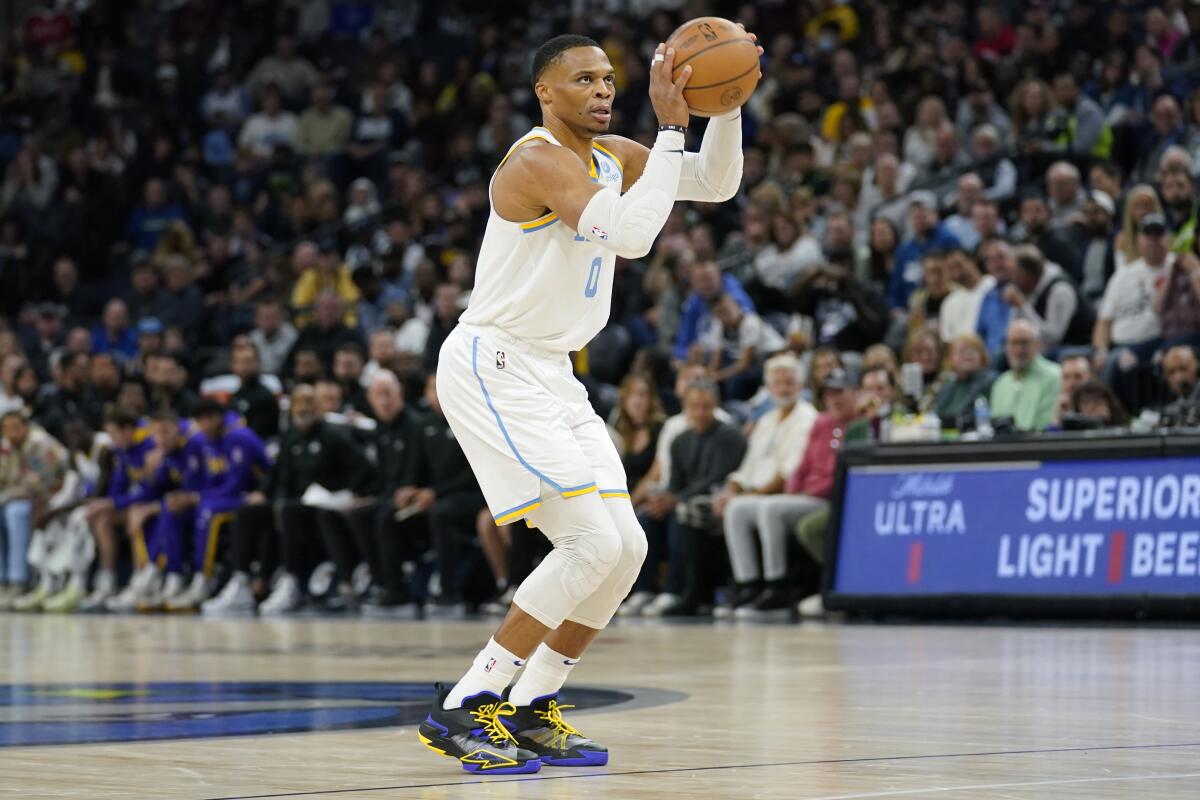 Lakers guard Russell Westbrook attempts a wide-open three-point shot against the Timberwolves.
