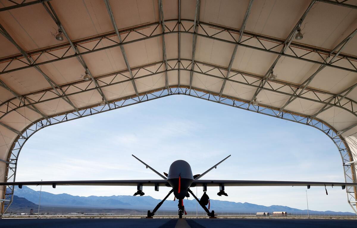 An MQ-9 Reaper remotely piloted aircraft is parked in an aircraft shelter at Creech Air Force Base in Indian Springs, Nevada. Enlisted Air Force personnel will be allowed to become drone pilots, according to a new policy.