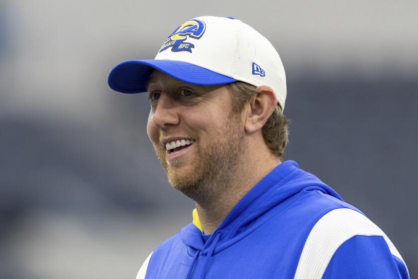 Rams offensive coordinator Liam Coen smiles before the Rams play against the Seattle Seahawks