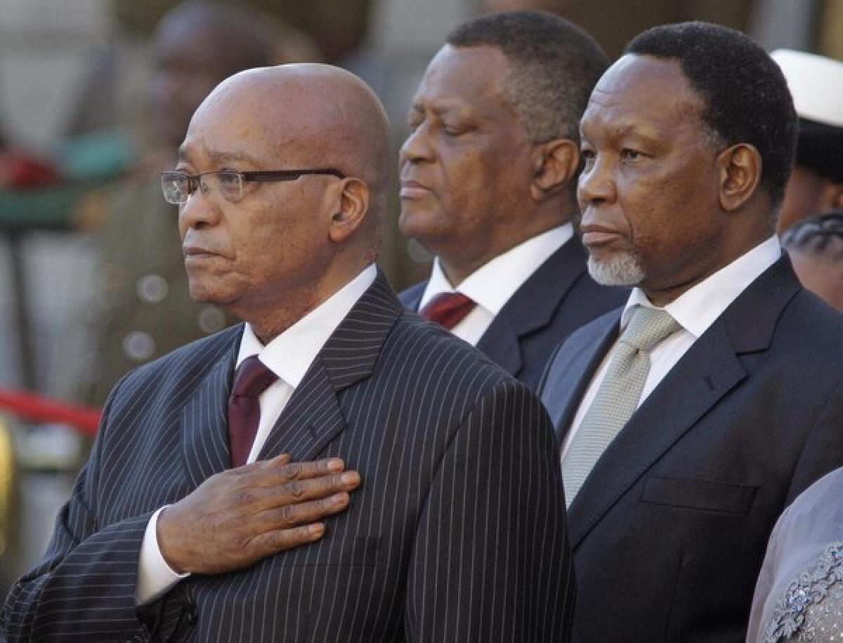 South African President Jacob Zuma, left, and Deputy President Kgalema Motlanthe, right, at the opening of Parliament in Cape Town, South Africa, on Feb. 9.