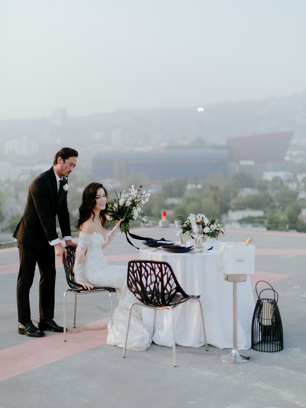 A helipad wedding at Sofitel Los Angeles at Beverly Hills offers views of downtown L.A. and the Hollywood Hills.