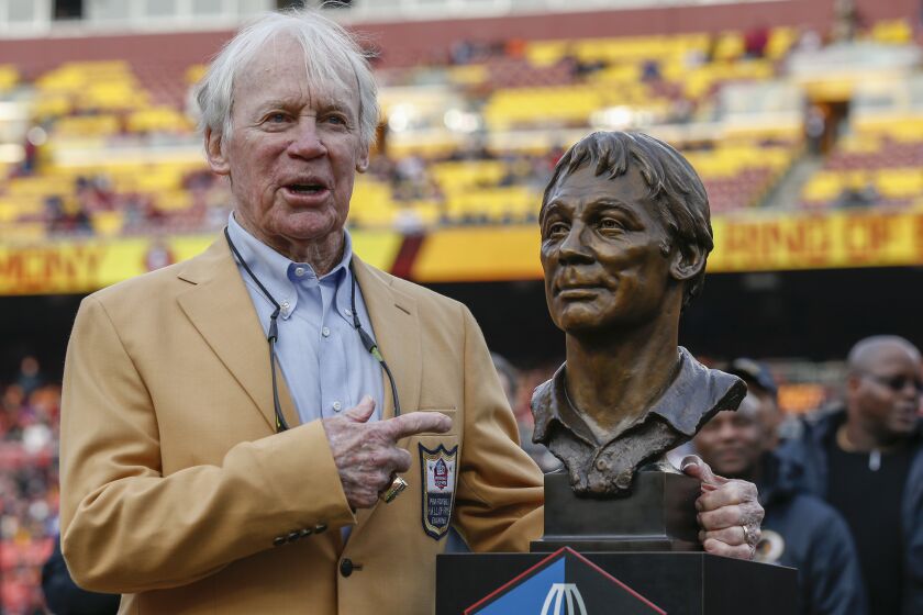 FILE - Former Washington Redskins general manager Bobby Beathard poses with his Hall of Fame trophy during halftime of an NFL football game between the Houston Texans and the Washington Redskins, Nov. 18, 2018 in Landover, Md. The four-time Super Bowl winning executive has died. He was 86. A spokesperson for the Washington Commanders said Beathard's family told the team he died earlier this week at his home in Franklin, Tennessee. (AP Photo/Alex Brandon, file)