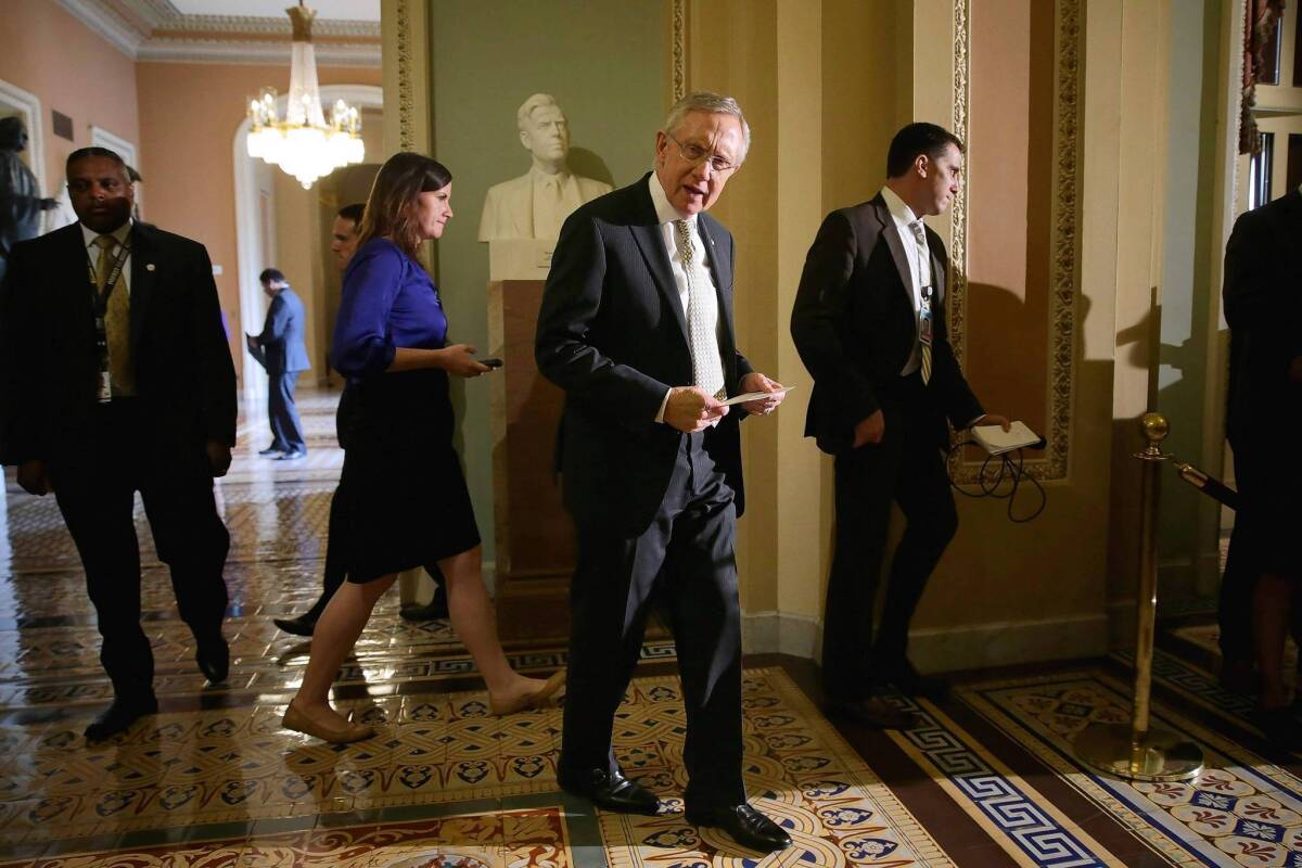 Senate Majority Leader Harry Reid (D-Nev.), center, arrives at a July news conference at which he criticized House Republicans over the sequester.