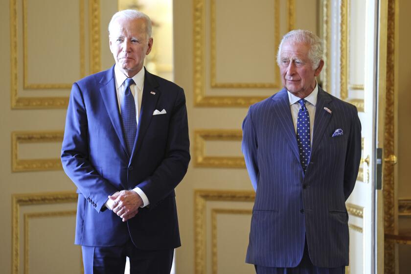 U.S. President Joe Biden, left, and Britain's King Charles III meet inside Windsor Castle, England, Monday July 10, 2023. (Chris Jackson/Pool via AP)