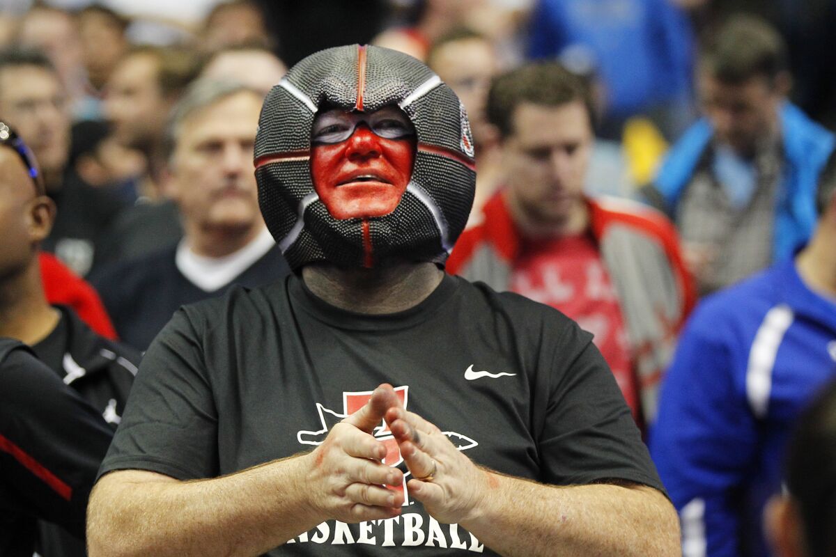 SDSU fans cheer during the Arizona game during a Sweet 16 game of the NCAA Tournament at the Honda Center in Anaheim.