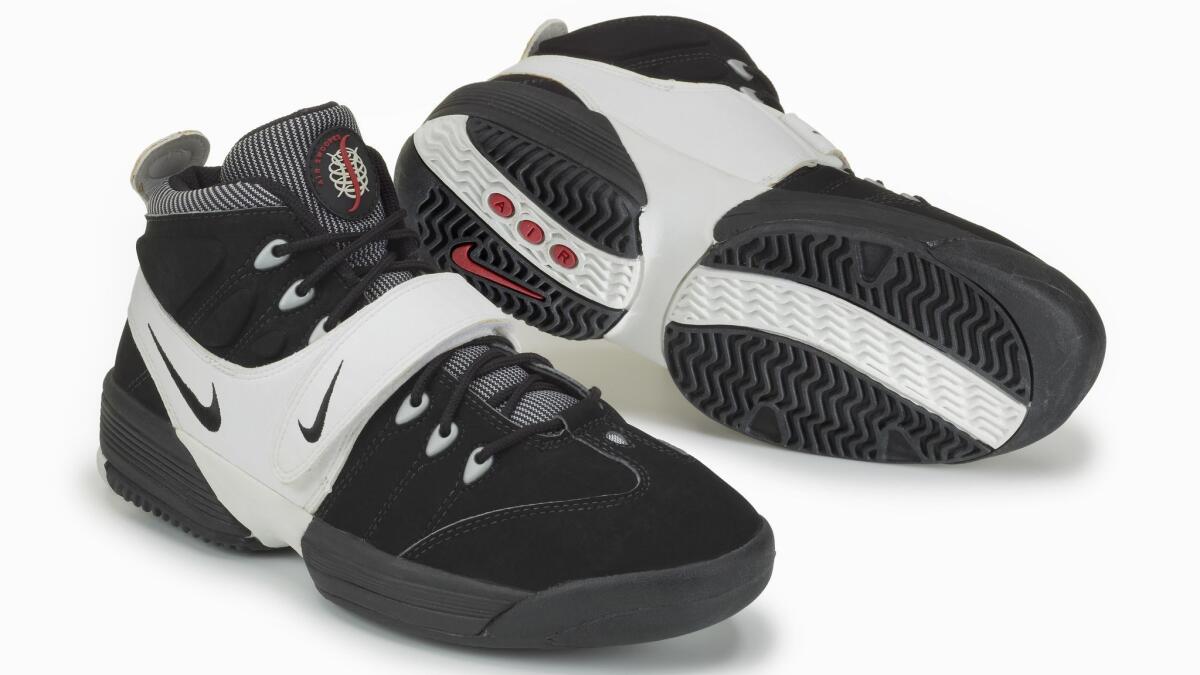 The Nike Air Swoopes, the debut signature shoe named in honor of Sheryl Swoopes, included a midfoot stability strap and a stylized basketball-meets-"S" logo on the tongue.